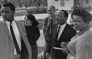 Rev. Jesse Jackson; Joan Baez; Ira Sandperl; Dr. Martin Luther King, Jr.; and Dora McDonald on the Penn Center campus in 1964